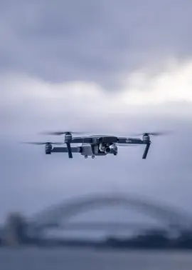 drone hovering up min scaled